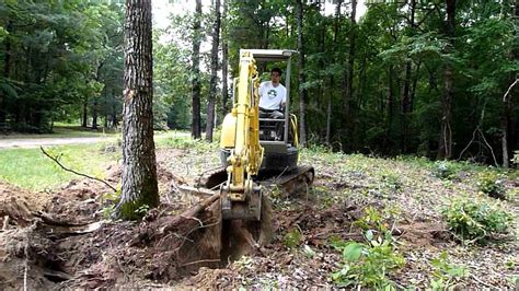 mini excavator clearing trees|mini excavators for tree removal.